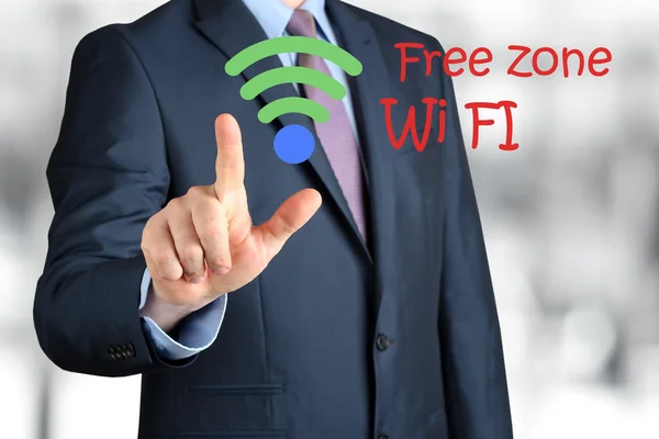 Bisinessman  in  a modern suit Touching   asign of wi-fi — Stock Photo, Image