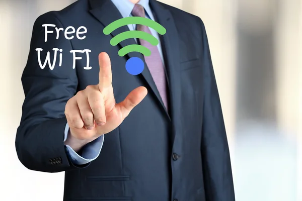 Bisinessman  in  a modern suit Touching   asign of wi-fi — Stock Photo, Image