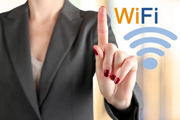 Mujer de negocios tocando una palabra "Wi Fi  " —  Fotos de Stock