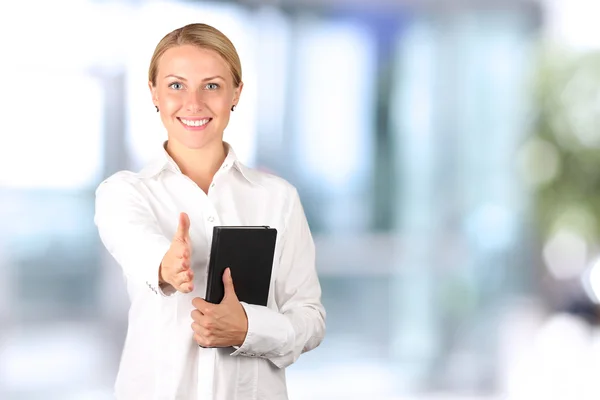 Beautiful  business woman giving a handshake — Stock Photo, Image