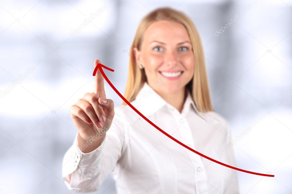 Businesswoman  touching a virtual Graph by hand.  Blue background beside