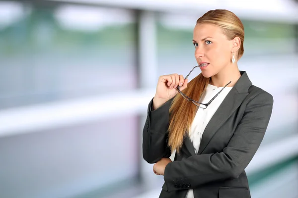 Young businesswoman thinking about an idea — Stock Photo, Image