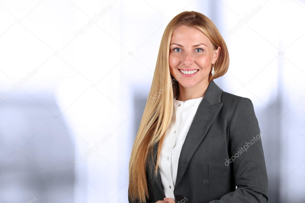 Beautiful smiling business woman  portrait. Isolated on a white
