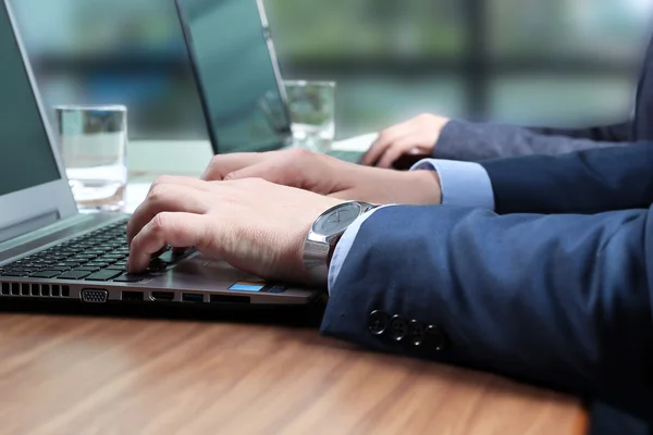 The Buisness Workers At Desks with a laptop In Busy Creative Office — Stock Photo, Image