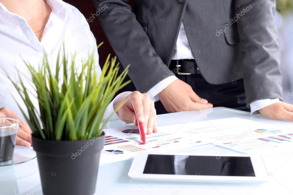 The Buisness Workers At Desks with a laptop In Busy Creative Office