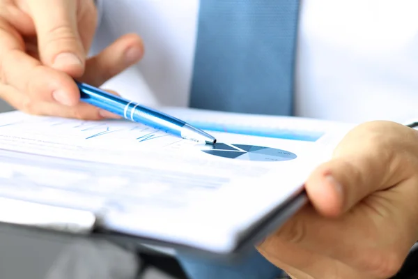 Business colleagues working and analyzing financial figures on a graphs — Stock Photo, Image