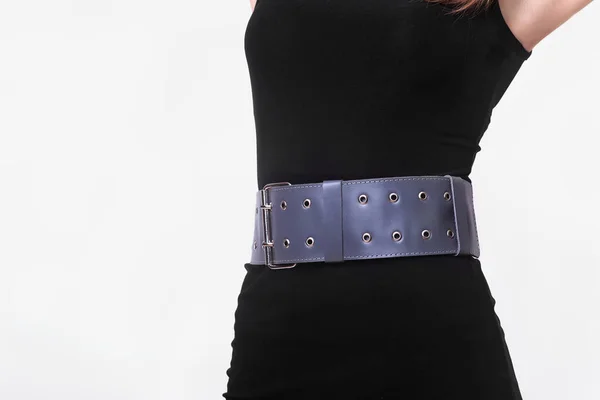 Wide leather accessory in the form of a belt with a metal buckle on the belt. Office style. Fancy onion. Handmade leather product. Quality leather products