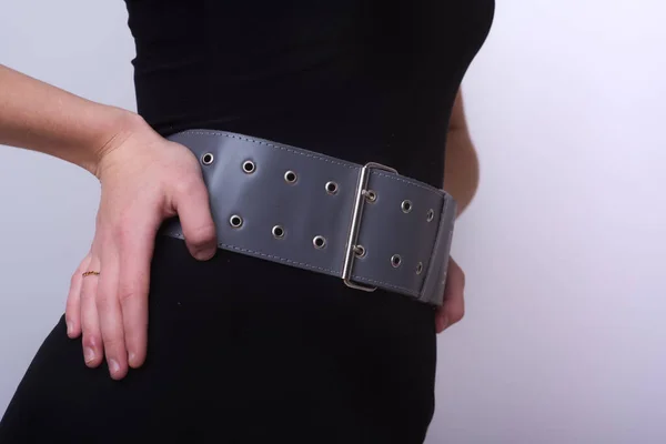 Wide leather accessory in the form of a belt with a metal buckle on the belt. Office style. Fancy onion. Handmade leather product. Quality leather products