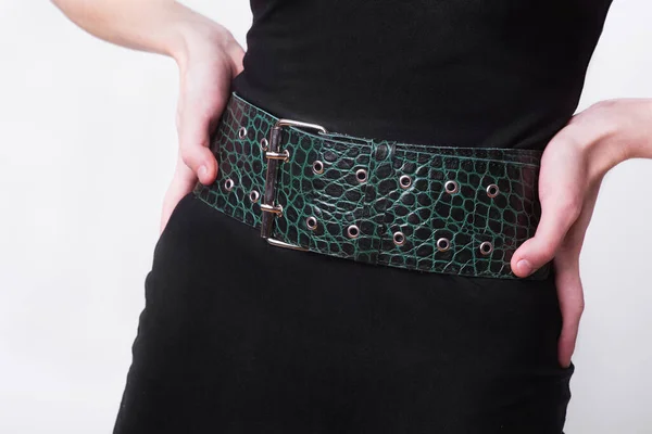 Wide leather accessory in the form of a belt with a metal buckle on the belt. Office style. Fancy onion. Handmade leather product. Quality leather products