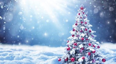 Snowy Christmas Tree With Red Balls In A Winter Landscape clipart