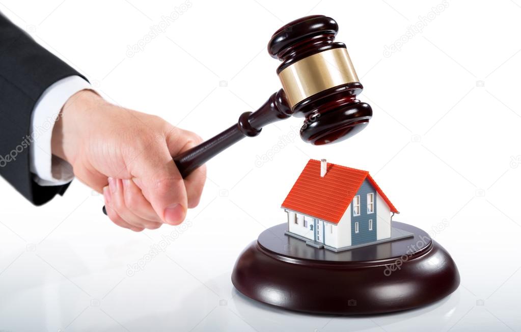 Gavel on house - auction of real estate