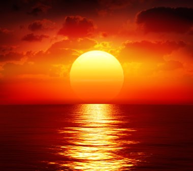 Sunset over calm sea clipart