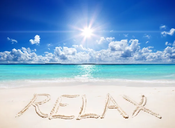 Written relax on sand of the tropical beach with sun — Stock Photo, Image