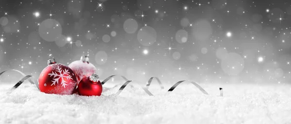 Red Baubles On Snow With Sparkling Stars On Silver Background — Stock Photo, Image