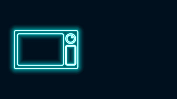 Glödande neon linje Mikrovågsugn ikon isolerad på svart bakgrund. Ikonen för hushållsapparater. 4K Video motion grafisk animation — Stockvideo