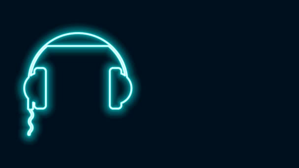 Gloeiende neon lijn Koptelefoon pictogram geïsoleerd op zwarte achtergrond. Oortelefoons ondertekenen. Concept voor het luisteren naar muziek, service, communicatie en operator. 4K Video motion grafische animatie — Stockvideo