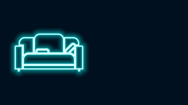 Glödande neon linje soffa ikon isolerad på svart bakgrund. 4K Video motion grafisk animation — Stockvideo