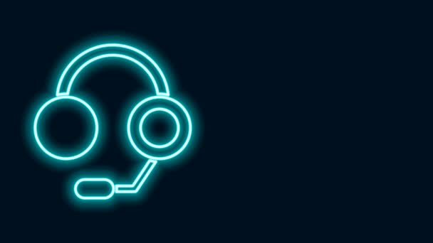 Glowing neon line Headphones icon isolated on black background. Earphones. Concept for listening to music, service, communication and operator. 4K Video motion graphic animation — Stock Video