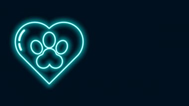 Parlayan neon çizgisi. Siyah zemin üzerinde hayvanların ayak izi ikonu olan kalp. Yüreğindeki evcil hayvan pençesi. Hayvanlara sevgiler. 4K Video hareketli grafik canlandırması
