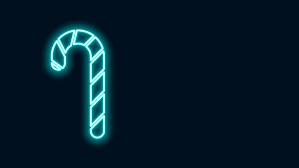 Ligne de néon brillant Canne à bonbons de Noël avec icône rayures isolées sur fond noir. Joyeux Noël et bonne année. Animation graphique de mouvement vidéo 4K — Video