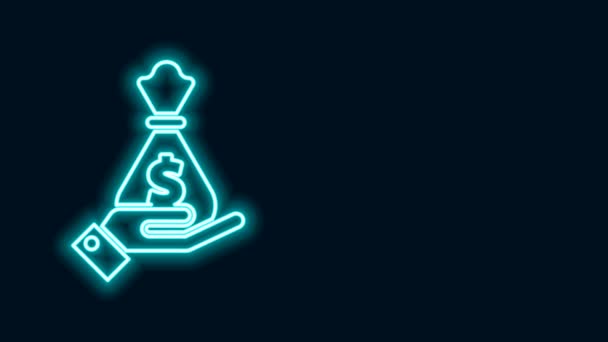 Glowing neon line Hand holding money bag icon isolated on black background. Dollar or USD symbol. Cash Banking currency sign. 4K Video motion graphic animation — Stock Video