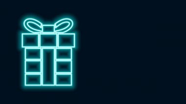 Parlayan neon hattı hediye kutusu simgesi siyah arkaplanda izole edildi. Mutlu Noeller ve mutlu yıllar. 4K Video hareketli grafik canlandırması