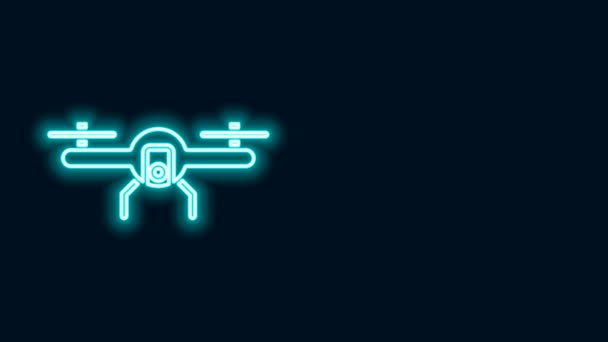 Žhnoucí neonová čára Letící ikona Drone izolovaná na černém pozadí. Quadrocopter se symbolem videokamery a fotoaparátu. Grafická animace pohybu videa 4K — Stock video