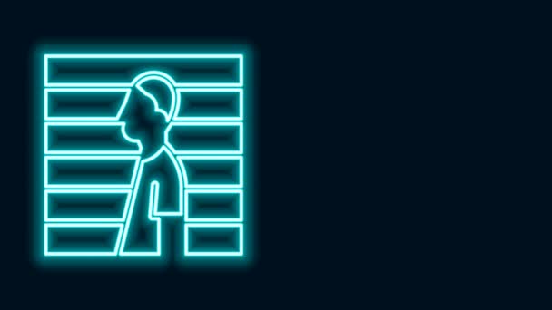 Glowing neon line Suspect criminal icon isolated on black background. The criminal in prison, suspected near the board. 4K Video motion graphic animation — Stock Video