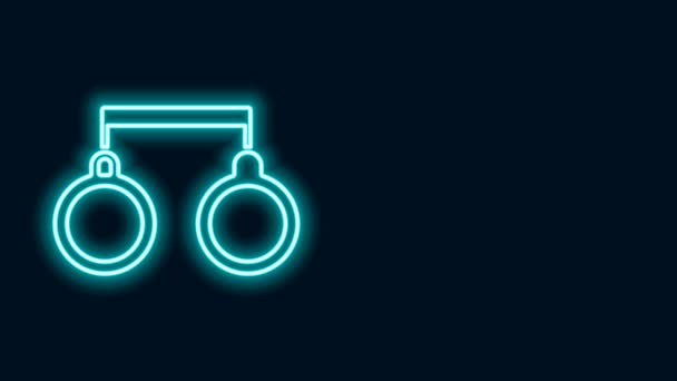 Glowing neon line Handcuffs icon isolated on black background. 4K Video motion graphic animation — Stock Video