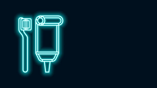 Glowing neon line Toothbrush and tube of toothpaste icon isolated on black background. Disposable bathroom supplies. 4K Video motion graphic animation — Stock Video