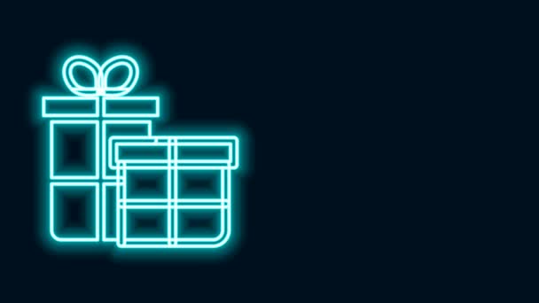 Świecąca neonowa linia Ikona pudełka upominkowego izolowana na czarnym tle. Wesołych Świąt i szczęśliwego Nowego Roku. 4K Animacja graficzna ruchu wideo — Wideo stockowe
