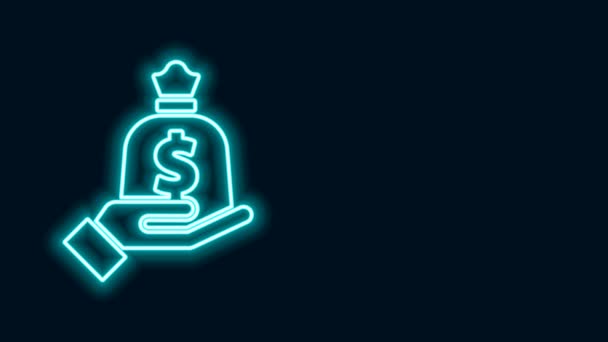 Glowing neon line Hand holding money bag icon isolated on black background. Dollar or USD symbol. Cash Banking currency sign. 4K Video motion graphic animation — Stock Video