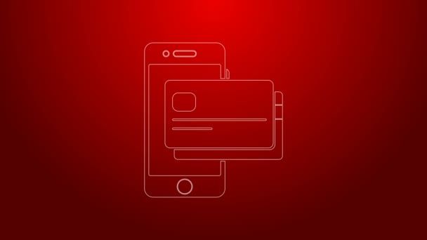 Grön linje Mobiltelefon och kreditkort ikon isolerad på röd bakgrund. Smartphone online betalningskoncept. NFC-betalning. Överför ikonen. 4K Video motion grafisk animation — Stockvideo
