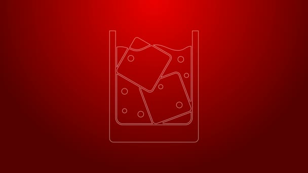 Green line Glass of whiskey and ice cubes icon isolated on red background. 4K Video motion graphic animation — Stock Video