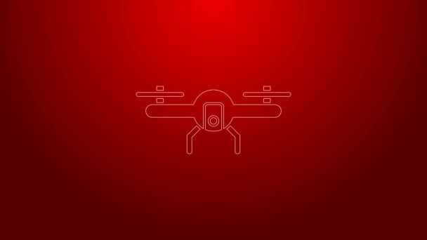 Green line Drone flying icon isolated on red background. Quadrocopter with video and photo camera symbol. 4K Video motion graphic animation — Stock Video