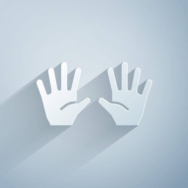 Kağıt kesiği. Gri arka planda tıbbi lastik eldiven ikonu var. Koruyucu lastik eldivenler. Kağıt sanatı tarzı. Vektör.