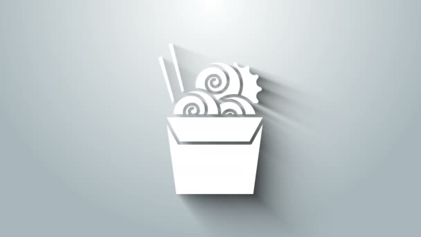 White Asian noodles in paper box and chopsticks icon isolated on grey background. Street fast food menu. Korean, Japanese, Chinese food. 4K Video motion graphic animation — Wideo stockowe