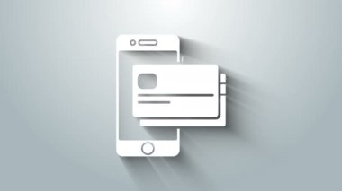 Gri arkaplanda beyaz cep telefonu ve kredi kartı simgesi izole edildi. Akıllı telefon çevrimiçi ödeme konsepti. NFC ödemesi. Aktarım simgesi. 4K Video hareketli grafik canlandırması