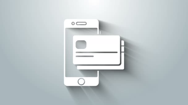 Witte mobiele telefoon en creditcard pictogram geïsoleerd op grijze achtergrond. Smartphone online betaling concept. NFC betaling. Overdracht icoon. 4K Video motion grafische animatie — Stockvideo