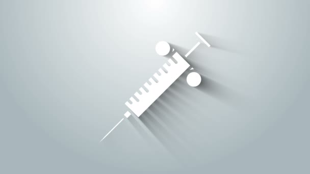 Біла піктограма шприца ізольована на сірому фоні. Шприц для вакцинації, щеплення, ін'єкцій, грипу. Медичне обладнання. 4K Відео рух графічна анімація — стокове відео