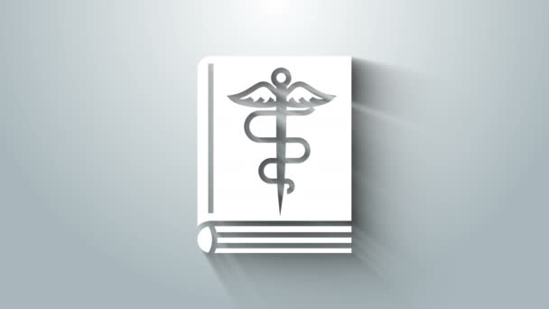 White Medical book icoon geïsoleerd op grijze achtergrond. 4K Video motion grafische animatie — Stockvideo