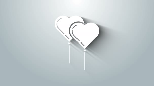 Balon putih dalam bentuk hati dengan ikon pita terisolasi pada latar belakang abu-abu. Animasi grafis gerak Video 4K — Stok Video