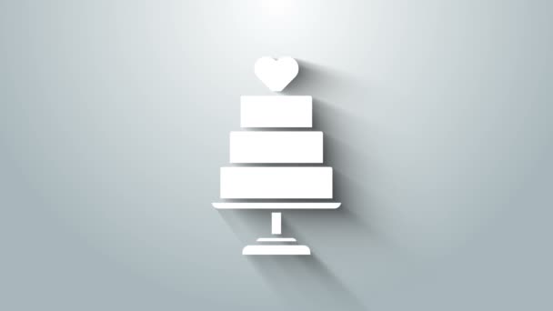 Weiße Hochzeitstorte mit Herz-Symbol auf grauem Hintergrund. 4K Video Motion Grafik Animation — Stockvideo
