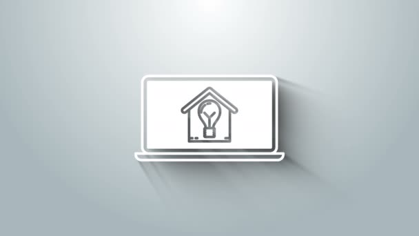 Ordenador portátil blanco con casa inteligente y bombilla icono aislado sobre fondo gris. Animación gráfica de vídeo 4K — Vídeo de stock
