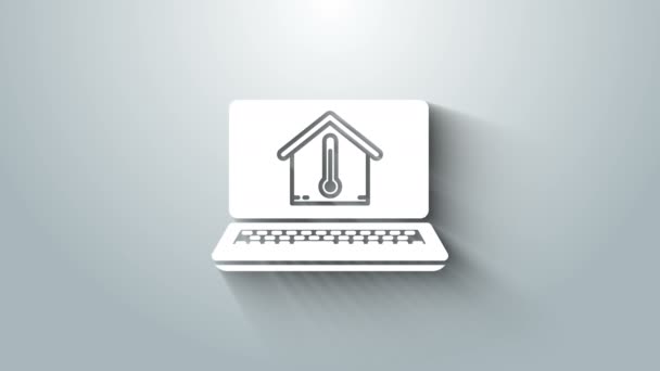 Білий ноутбук з піктограмою температури будинку ізольовано на сірому фоні. Піктограма термометра. 4K Відео рух графічна анімація — стокове відео