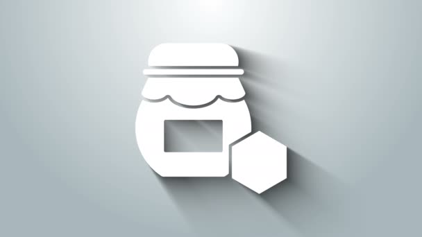Bílá sklenice medu ikon izolované na šedém pozadí. Jídlo. Symbol sladkého přírodního jídla. Grafická animace pohybu videa 4K — Stock video
