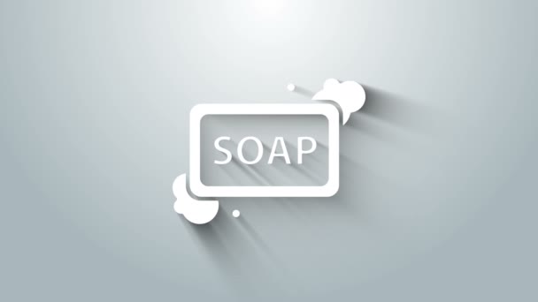 Barra blanca de jabón con icono de espuma aislado sobre fondo gris. Jabonera con burbujas. Animación gráfica de vídeo 4K — Vídeos de Stock