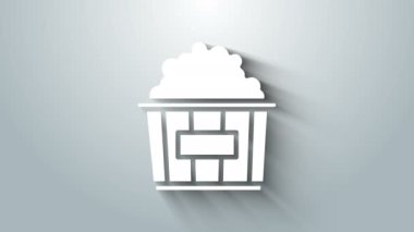 Beyaz patlamış mısır, gri arka planda izole edilmiş karton kutu simgesinde. Patlamış mısır kutusu. 4K Video hareketli grafik canlandırması