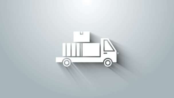 Bílé Dodávka kamion s lepenkovými krabicemi za ikonou izolované na šedém pozadí. Grafická animace pohybu videa 4K — Stock video
