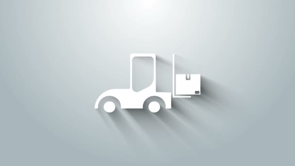 グレーの背景に隔離されたホワイトフォークリフトトラックのアイコン。フォークローダーと段ボール箱。貨物輸送輸送輸送輸送。4Kビデオモーショングラフィックアニメーション — ストック動画